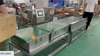 Checkweigher with rollers for 42kgs cartoon box.