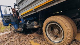 CAR STUCK  Stuck on a truck in the mud trying to turn around.  High heels boots in mud