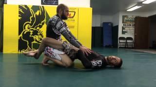 Arm in guillotine from guard gorilla grip