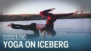 This couple used a floating iceberg on a Russian lake to perform their yoga routine