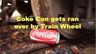 Coke Can gets ran over by Train Wheel