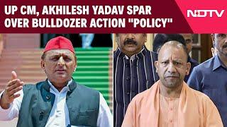 Yogi Adityanath Akhilesh Yadav Spar Over Bulldozer Action Policy