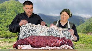 Juicy Meatloaf on a Spit Cooking outdoors in the Mountains of Azerbaijan