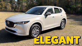 Elegant  2024 Mazda CX-5 Select in Platinum Quartz