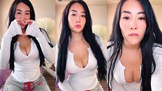 Cute Asian Girl Showing off cleavage