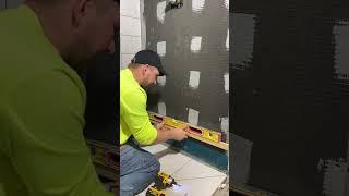 How to start tiling a shower wall. #shorts #youtubeshorts #diy