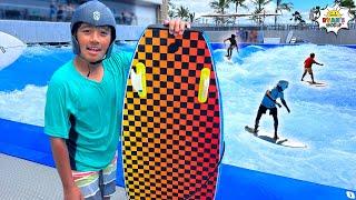 Ryan surfs on a giant wave pool