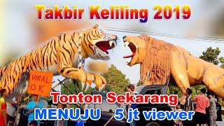 The Takbiran Eid al-Fitr carnival is full of large replicas of tigers fish cows ants lions