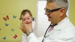 How To Calm A Crying Baby - Dr. Robert Hamilton Demonstrates The Hold Official