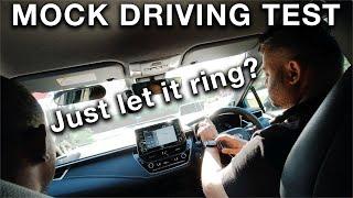 Driver Operates a Smart Watch While Doing His Mock Driving Test