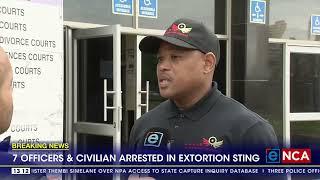 7 officers and civilian arrested in extortion sting