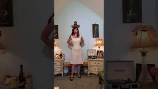 Dainty Rascal dancing in vintage white dress