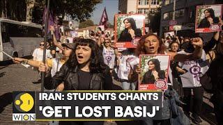 Iran Schoolgirls remove hijabs chant Get Lost Basij slogans at parliamentary speaker  WION News