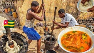 Cooking the most delicious Togolese yam fufu and fish light soup in Atakpame  Togo  West Africa .