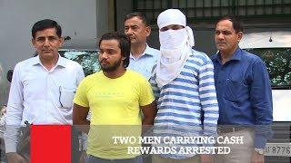 Two Men Carrying Cash Rewards Arrested