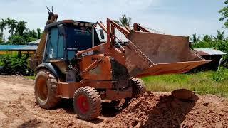 BACKHOE CASE 580 SUPER L TOLAK TANAH MERAH