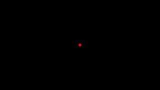 A black screen with a red dot in the middle that flickers for a frame every second for a minute