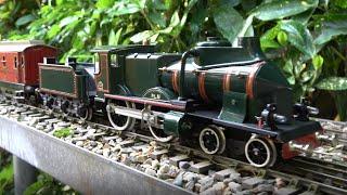 100 Years old Tinplate JEP cars including Postal van with a modern tinplate PLM Coupe-Vent loco