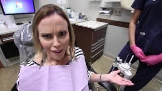 Dentist plays drums loudly while patient waits for him