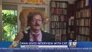 TV Commentators Cat Climbs Onto His Head During Interview