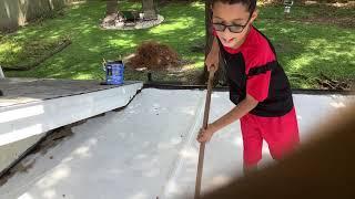 Helping my dad seal the patio roof.