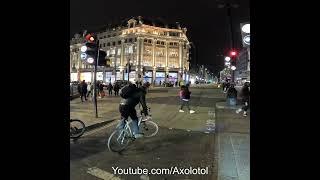 Police run red light on a bicycle at Oxford Circus