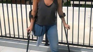 Beautiful woman with amputated leg walking with crutches #amputado