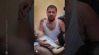 بكاء فلسطيني أثناء توديع ابنه الشهيد في قصف إسرائيلي بالنصيرات