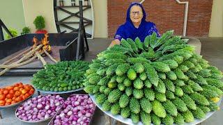 Karela Cooked In Our Traditional Style  Bitter Gourd Recipe  Village Cooking Recipe