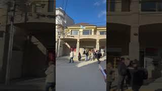 Waiters race while carrying food products in San Carlos de Bariloche