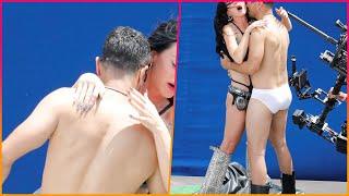 EXCLUSIVE Katy Perry flaunts her figure as she shares a raunchy kiss with a handsome shirtless