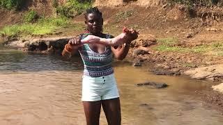 Check out how an African village girl had a beautiful moment in the river with a rabbit