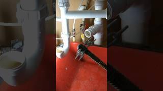 Snaking a kitchen sink drain blockage  #plumbing  #plumber #shortscreator