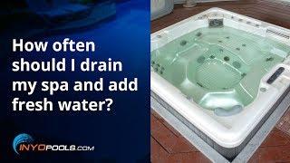 How often should I drain my spa and add fresh water?