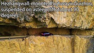 Aerial ChinaHezhang wall-mounted highway in Guizhou suspended on a steep cliff of about 90 degrees