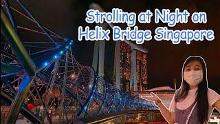 Walking through the Helix Bridge Singapore at night  World’s First Double-Helix on DNA Structure