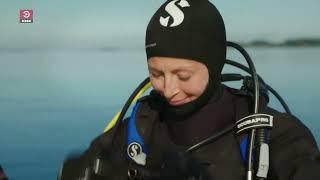 Female Presenter is Diving with Neoprene Drysuit in Sea