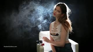 Pretty ukrainian girl 100 mm smoking in dark room