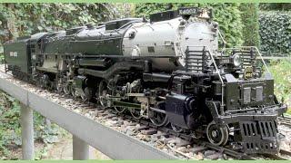 Union Pacific Big Boy Gauge 1 live steam made from an ASTER kit with a freight train in the garden