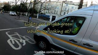 Van driver stopping traffic. Mobile phone using driver stopped at two sets of green lights. HW70ZFM