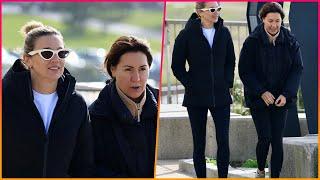 Jasmine Stefanovic gets down on one knee while enjoying a winter walk on Bondi Beach with her