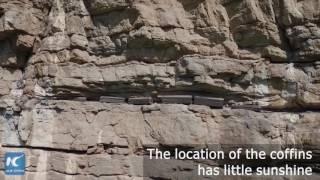 Cliff-hanging coffins survive 2000 years