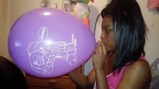 girl blowing up Mellyloon balloon