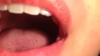 latina girl swallowing a gummy bear neck shot