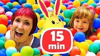 Kids play with dolls & Mommy for Lucky Toy slide & ball pit. Family fun video.