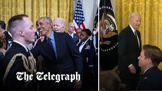 Biden appears lost in White House event as guests swarm around Barack Obama instead