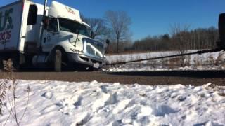 Chevy Duramax pulls Semi truck out of the ditch.