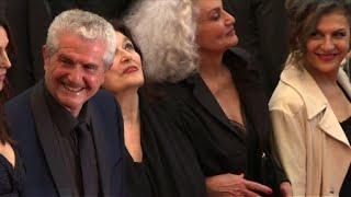 Cannes French director Claude Lelouch walks on the red carpet