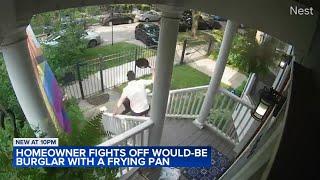Video shows homeowner chasing would-be burglar with frying pan out of his home into hands of police