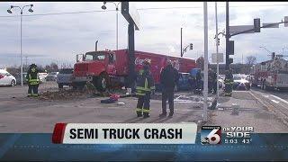 Pickup runs red light and crashes into coke truck